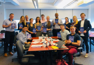 Carla D. Bass and a group of professionals at the conclusion of her workshop. All are holding a copy of her award-winning book "Write to Influence!" One topic discussed was the thank you note as a strategic leadership tool.